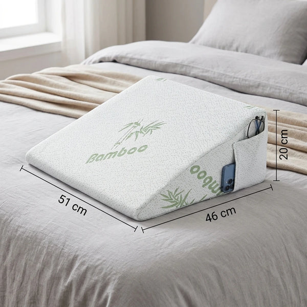 Wedge pillow shown propped up in bed