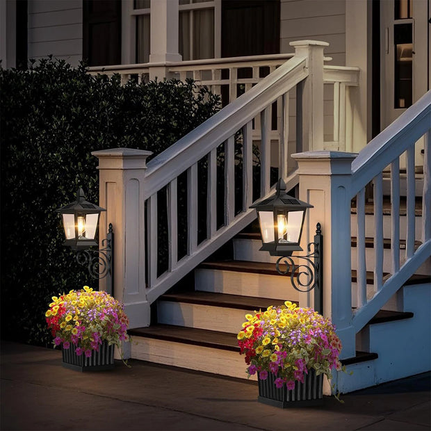 2-in-1 solar planter lamp lit up at night in outdoor garden setting